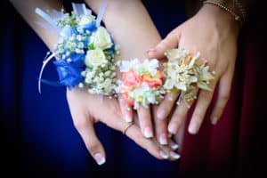 Blue white and coral prom corsages and flower rings