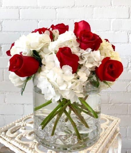red and white floral arrangement with roses & hyrdangeas