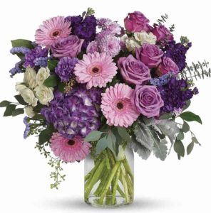 This harmonic mix of deep purple hydrangea with light lavender roses and sweet pink gerberas is a dreamy delight on any occasion.