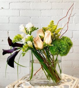 A beautiful and fragrant display of Peach Roses, Calla Lilies, Freesia, and more!